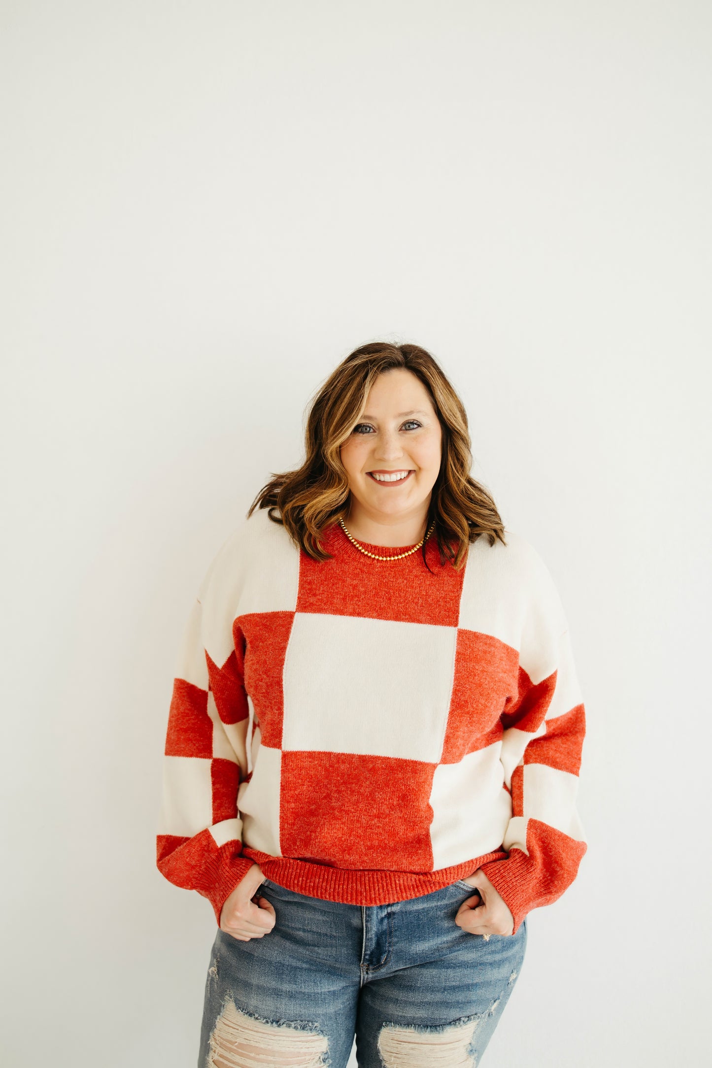 Emily Paige Designs Red Checkered Sweater Deposit